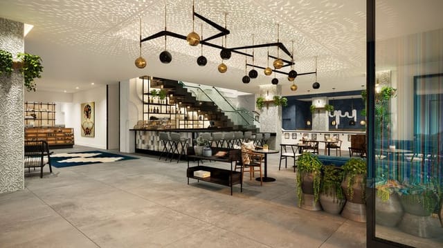 Modern event space in Kimpton Alma Hotel lobby with stylish decor and natural light.