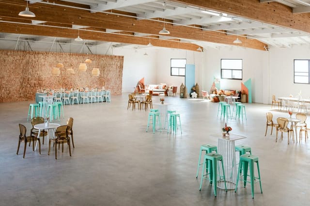 Spacious indoor event venue in Salt Drift Pointe with pastel seating and stylish decor.