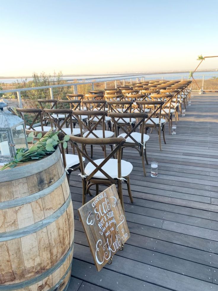 Elegant outdoor event space with wooden chairs at Salt Drift Pointe patio.