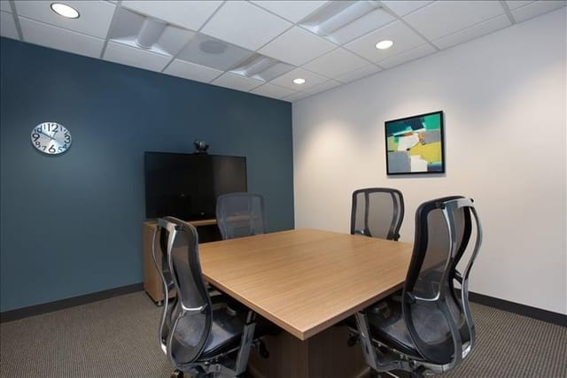 Modern conference room with ergonomic chairs for efficient meetings at 2447 Pacific Coast Highway.