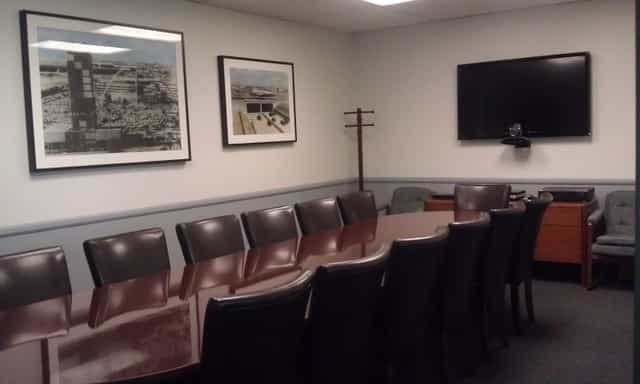 Day Office conference room with long table, ideal for meetings and presentations.
