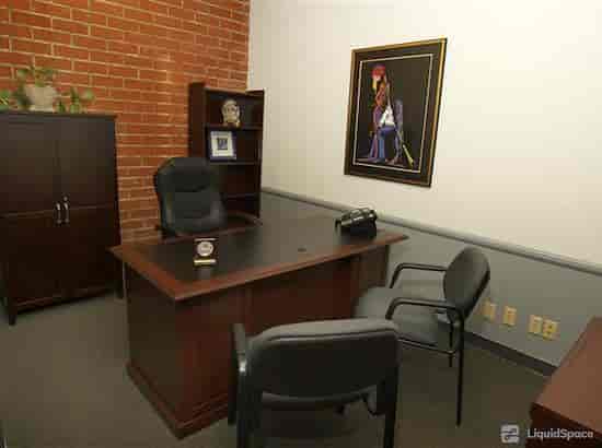Day Office in Sepulveda Business Center with sleek desk, ideal for meetings and consultations.