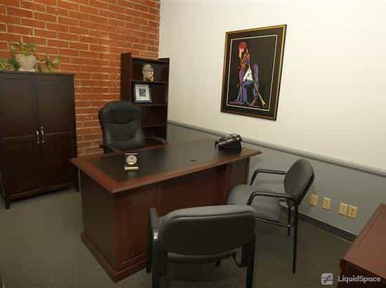 Day Office in Sepulveda Business Center with sleek desk, ideal for meetings and consultations.