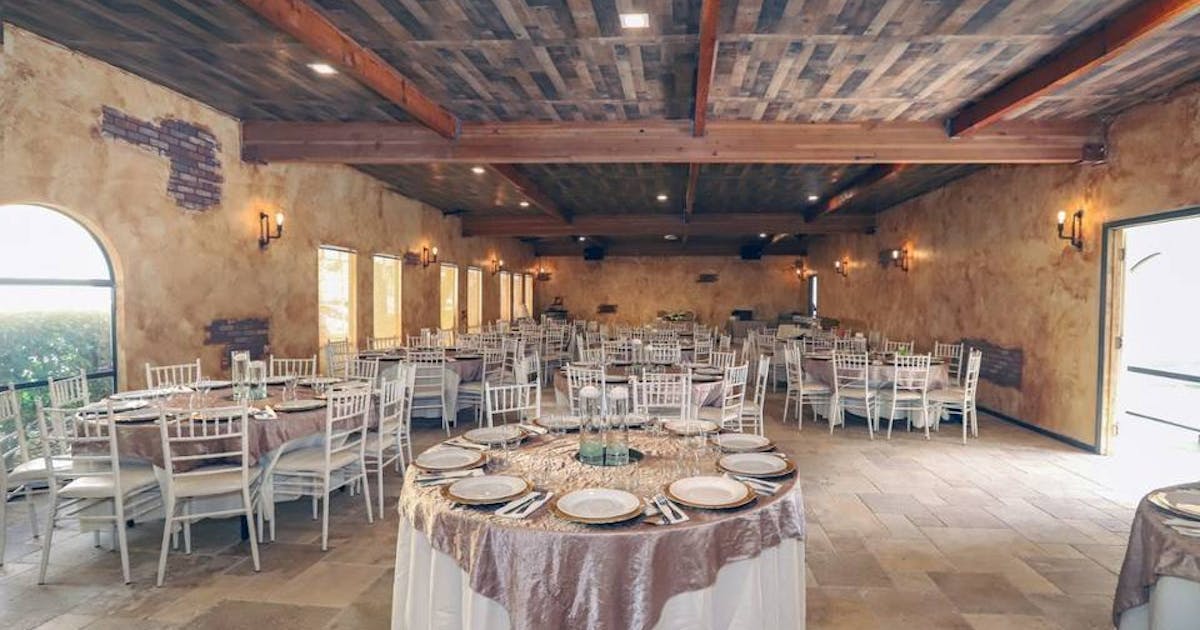 Grand Ballroom at Encore Event Center, elegant round table setup for banquets and receptions.