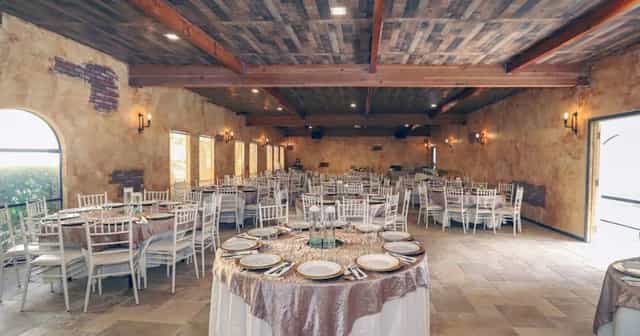 Grand Ballroom at Encore Event Center, elegant round table setup for banquets and receptions.