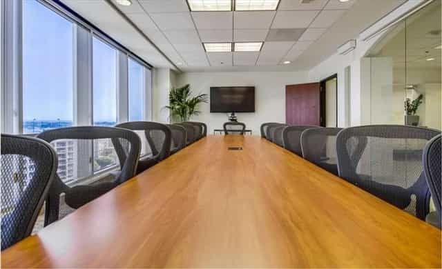 Modern conference room with wooden table for effective business meetings on Wilshire Blvd.