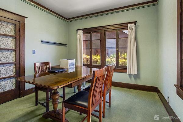 Marengo Avenue Meeting Center: bright room with wooden table for small meetings in Pasadena.