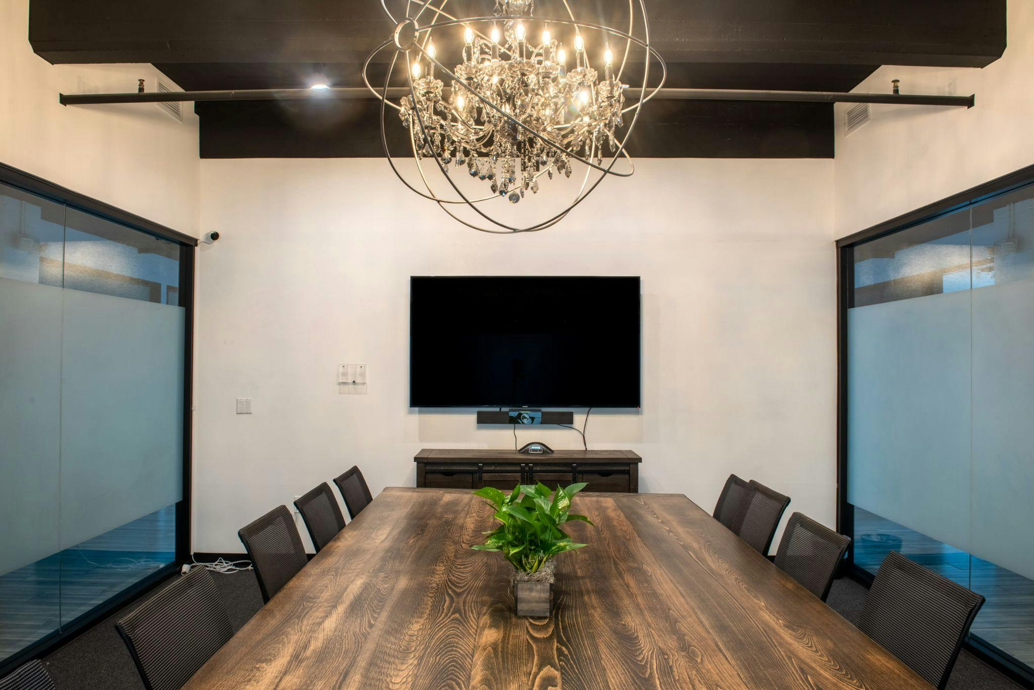 Modern conference room in Old Town Pasadena with large wooden table for meetings and events.