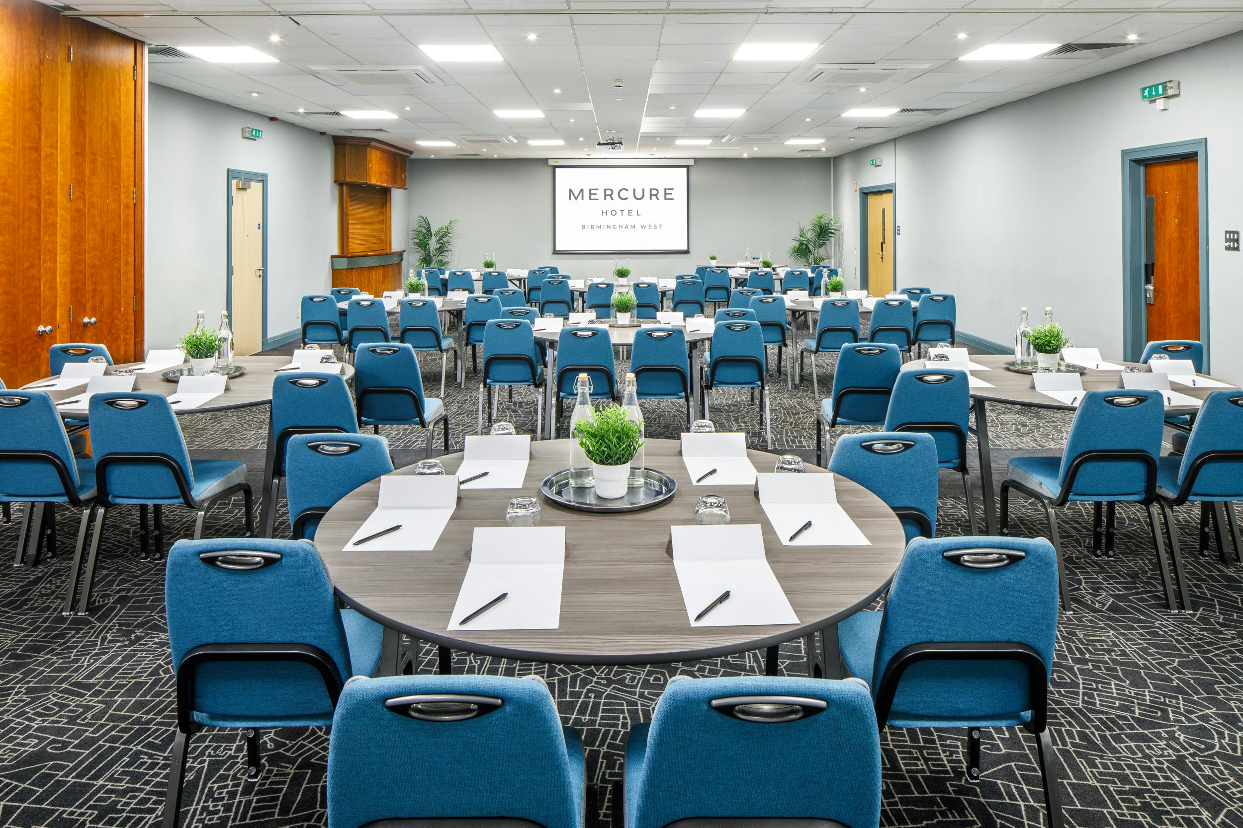 Hallard Suite at Mercure Birmingham West Hotel, corporate meeting room with round tables.