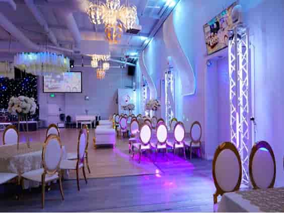 Spacious event hall with modern decor, perfect for meetings and celebrations.