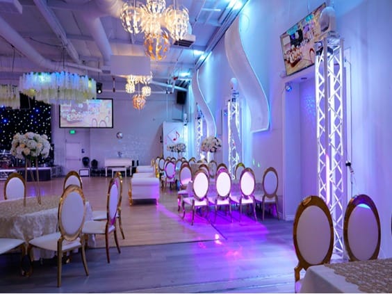 Spacious event hall with modern decor, perfect for meetings and celebrations.