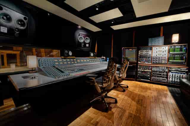 State-of-the-art recording studio with warm wood tones for creative workshops and events.