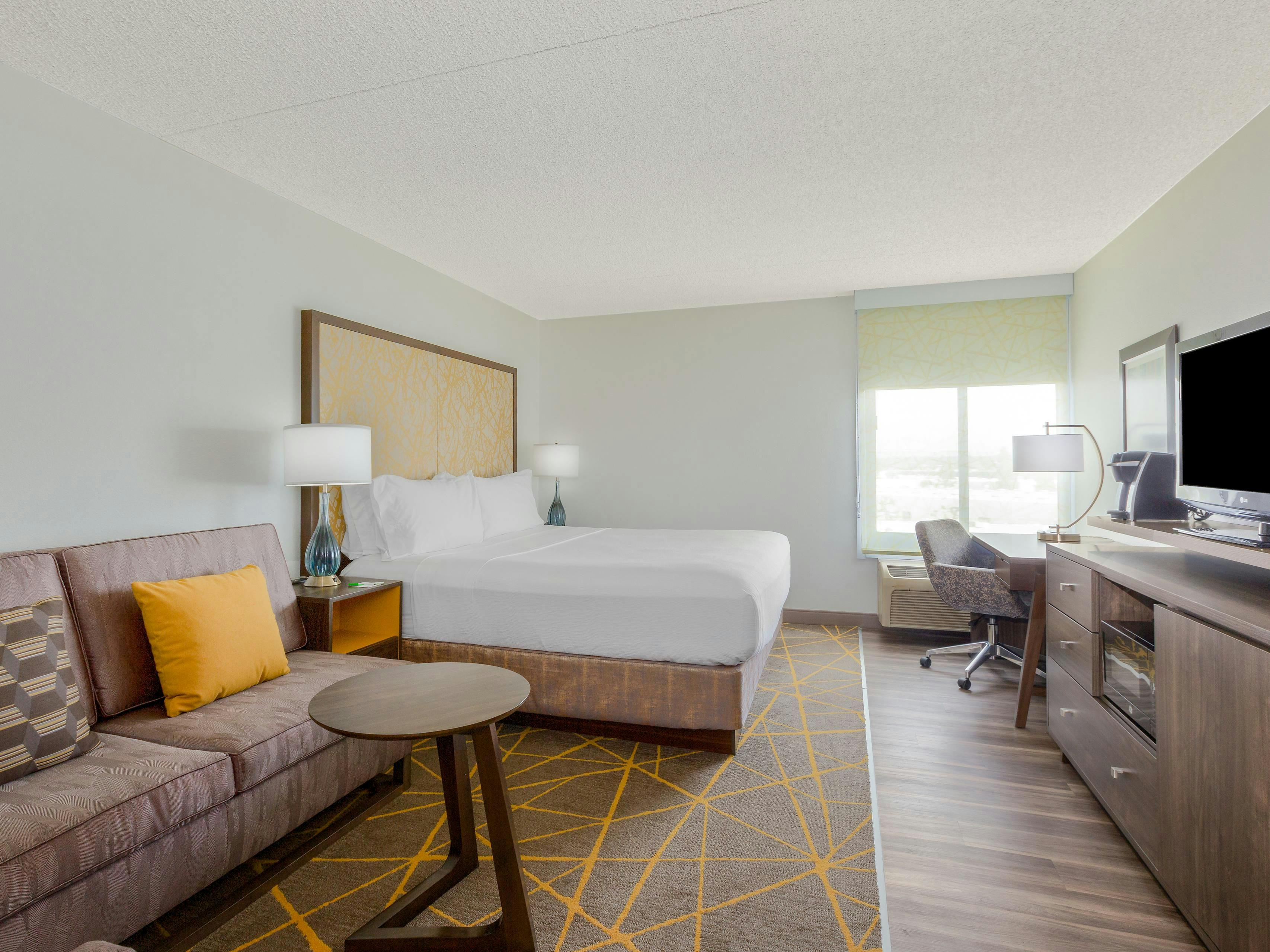 Spacious hotel room at Holiday Inn La Mirada, ideal for events and meetings.