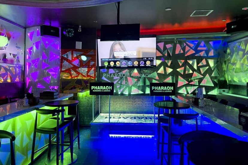 Private karaoke rooms with colorful lighting at XPRESS NIGHT CLUB for events and parties.