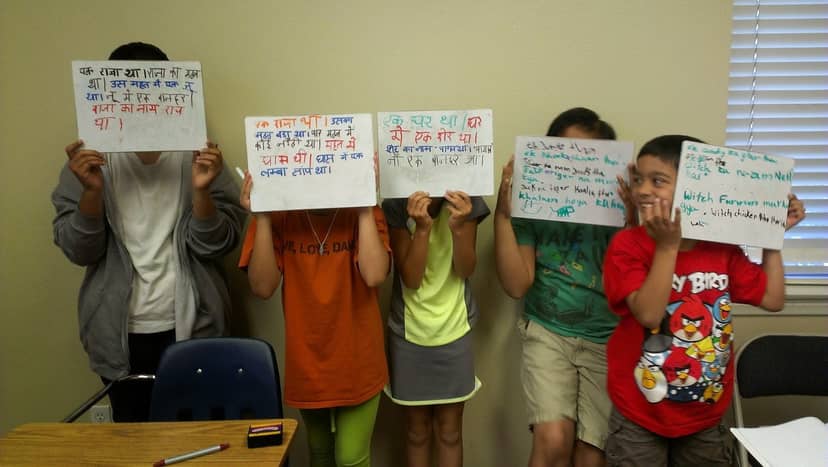 Children with whiteboards at Indus Heritage Center during an educational event.