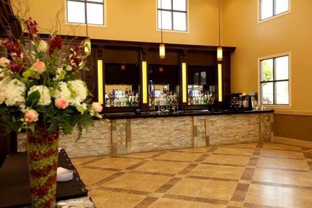 Spacious banquet hall in Artesia D.E.S. with elegant bar for events and receptions.