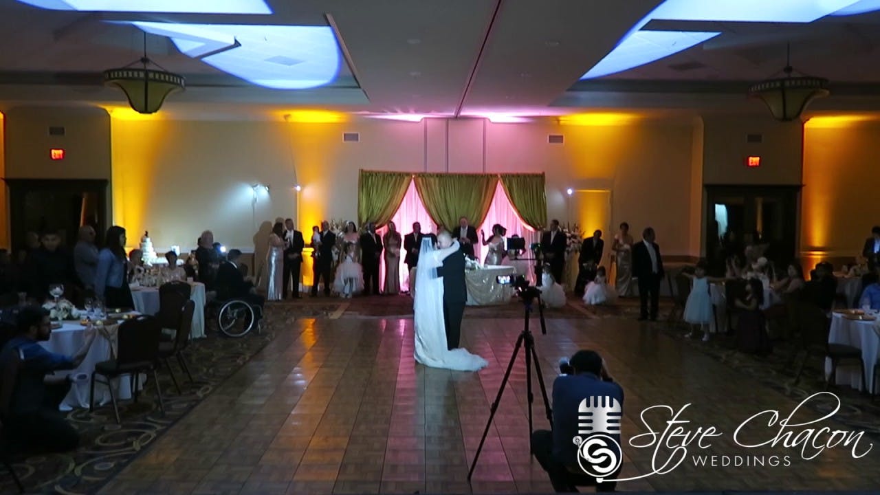 Wedding reception in Artesia D.E.S. with couple's first dance and elegant decor.