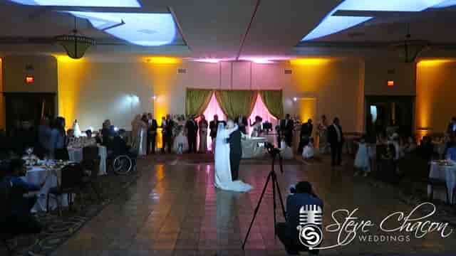 Wedding reception in Artesia D.E.S. with couple's first dance and elegant decor.