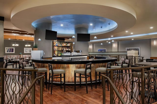 Modern bar area in DoubleTree by Hilton Norwalk, ideal for networking events and gatherings.