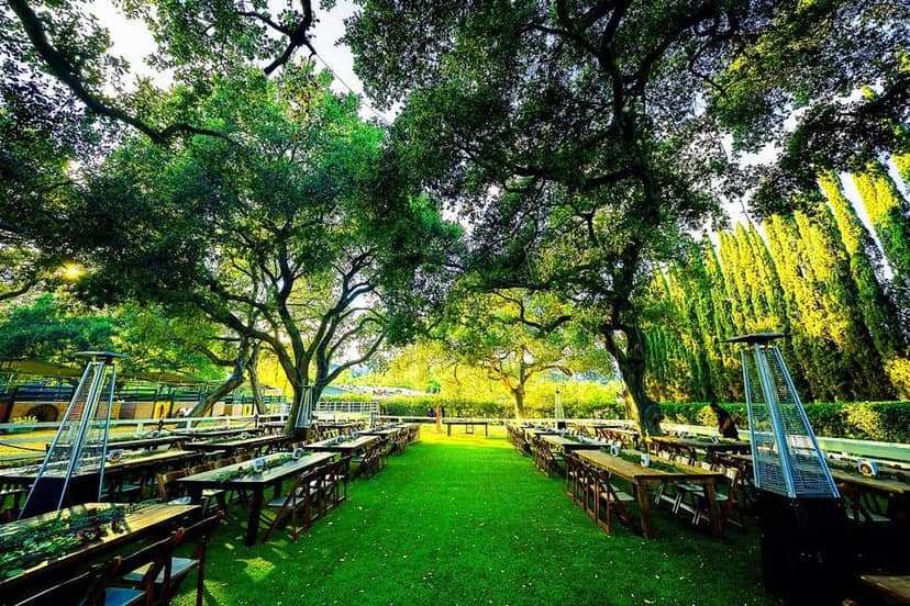 Outdoor event space at Rancho Los Felix with long tables, ideal for gatherings and celebrations.