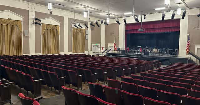 Neher Auditorium at San Marino High School, featuring red seating for events and performances.