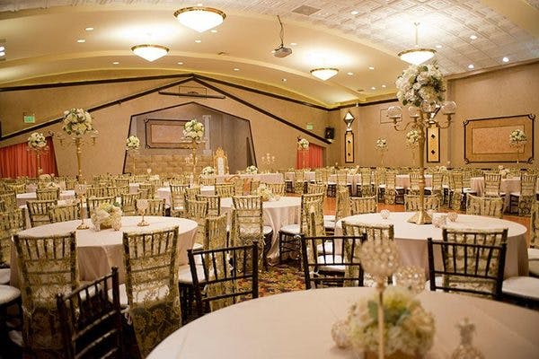 Elegant banquet hall with round tables, ideal for weddings and corporate events.