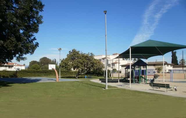 Outdoor courtyard at El Monte City Hall with playground, ideal for community events and gatherings.