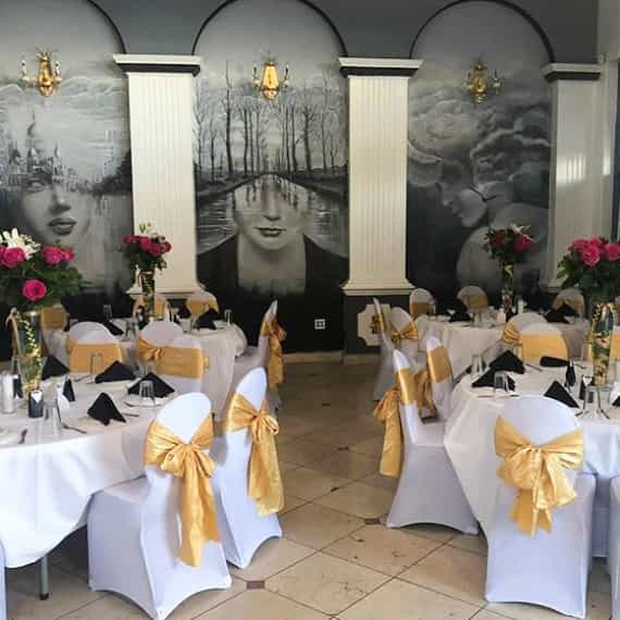 Elegant banquet hall with round tables for upscale events at Golden Rose Restaurant.