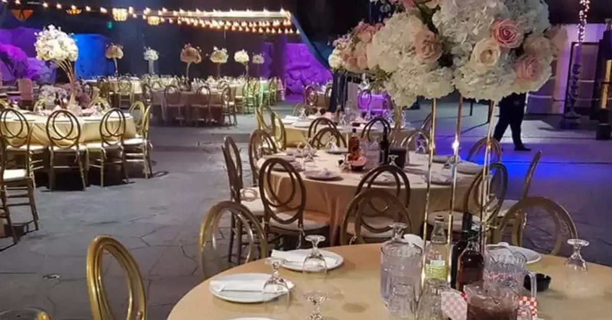 Elegant banquet hall with floral centerpieces for special events at Golden Rose Restaurant.