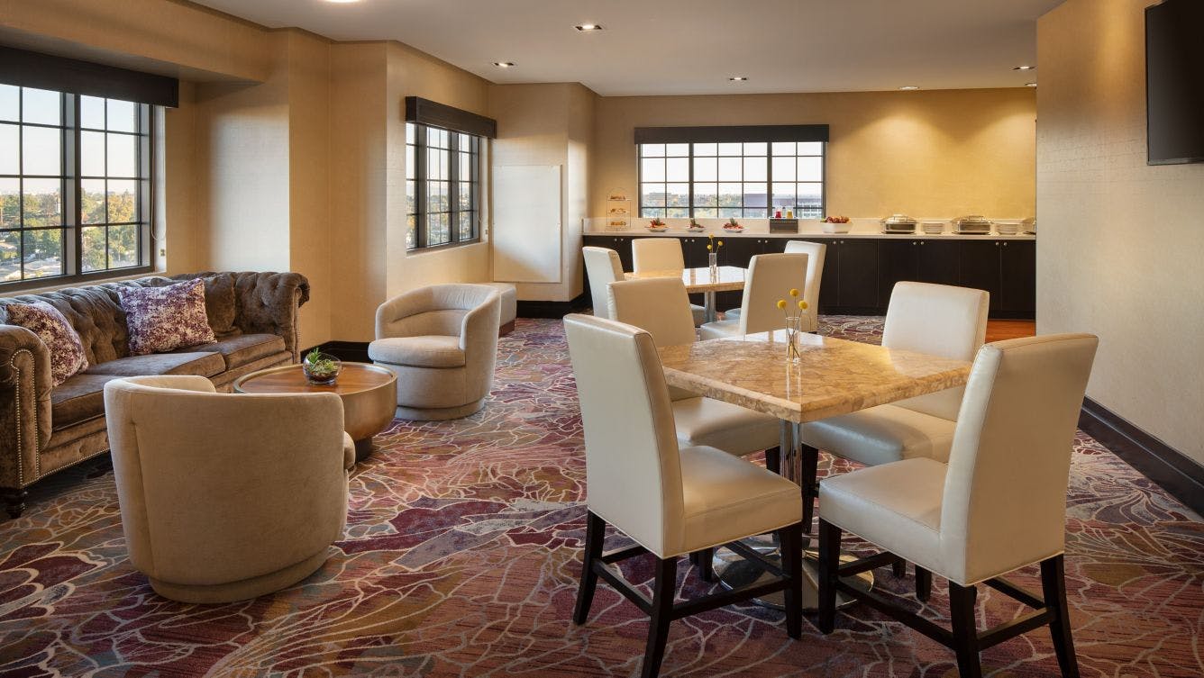 Club Lounge at Sheraton Garden Grove: elegant meeting space for networking events.