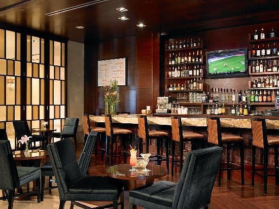 Stylish bar area in Sheraton Garden Grove for networking events and casual meetings.