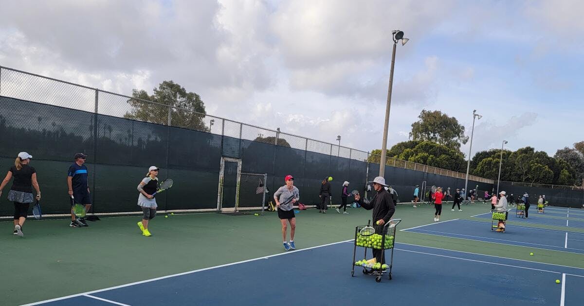 Point Loma Tennis Club community center during a vibrant team-building tennis session.