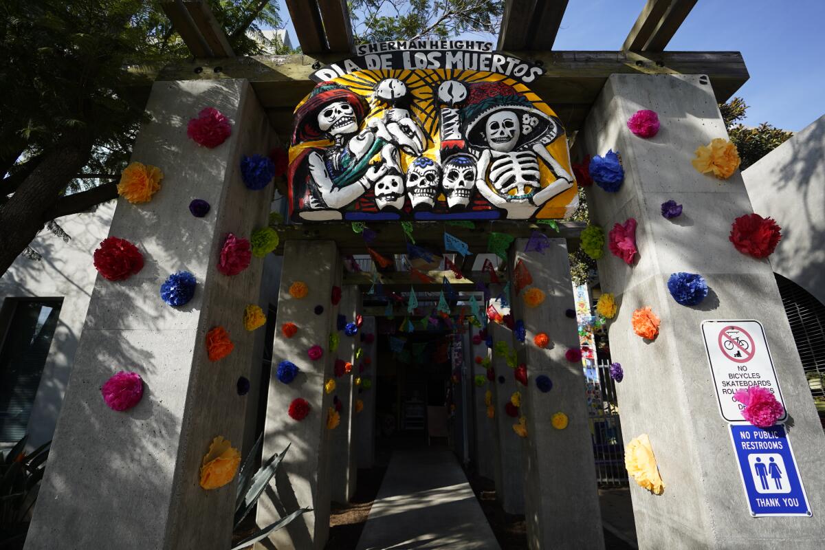 Sherman Heights Community Center entrance with colorful papel picado for Día de los Muertos event.