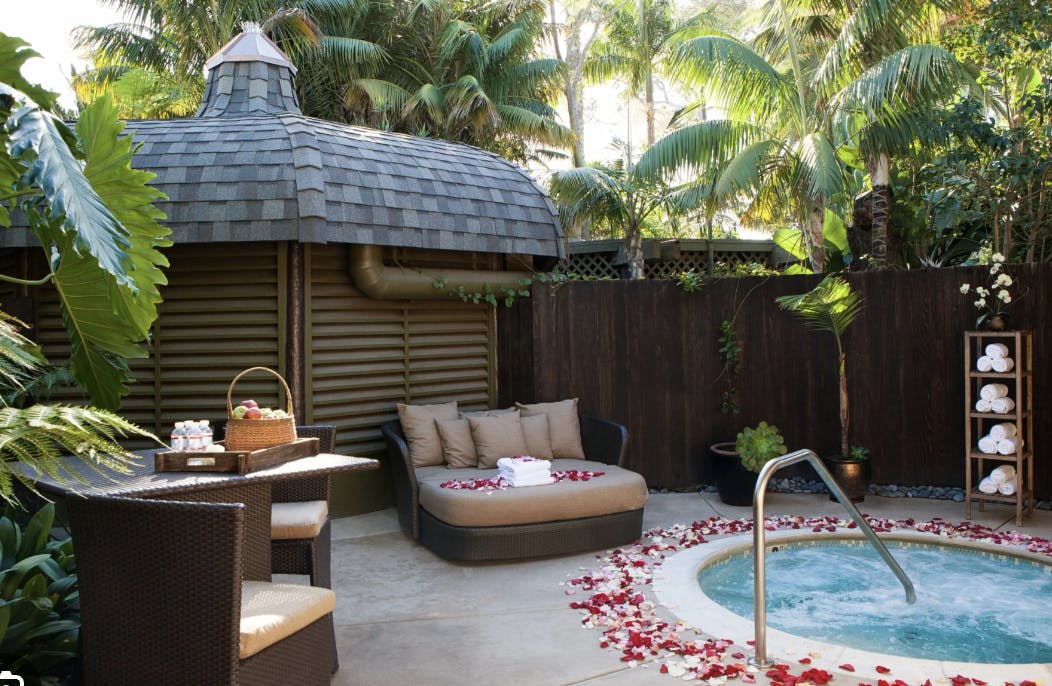 Serene outdoor spa with hot tub, ideal for wellness retreats and gatherings.