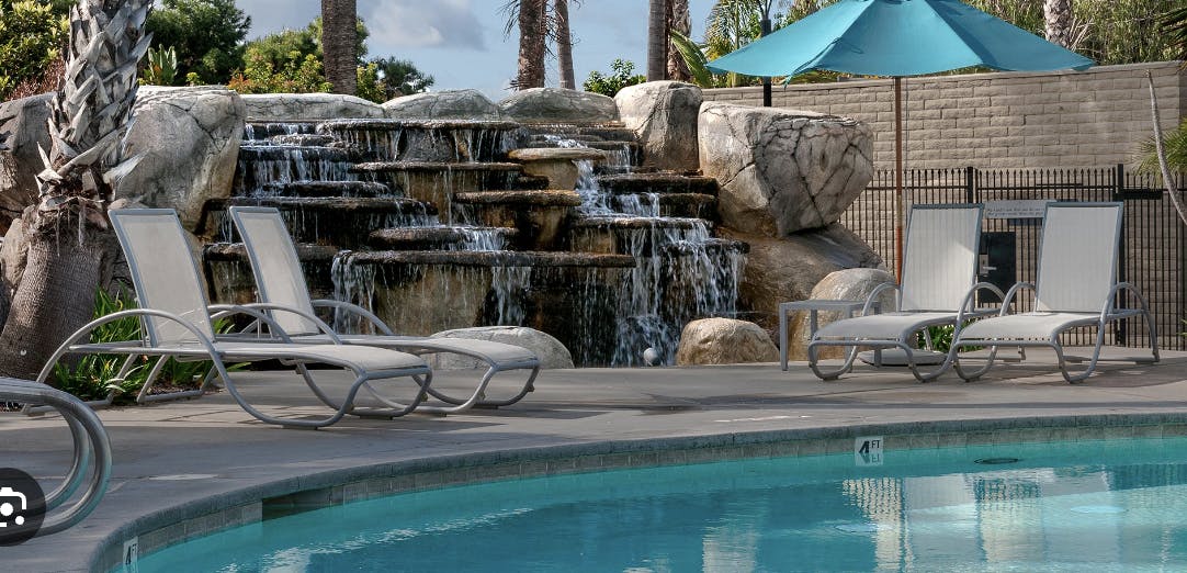 Lagoon Pool at The Point with waterfall, perfect for event relaxation and networking.