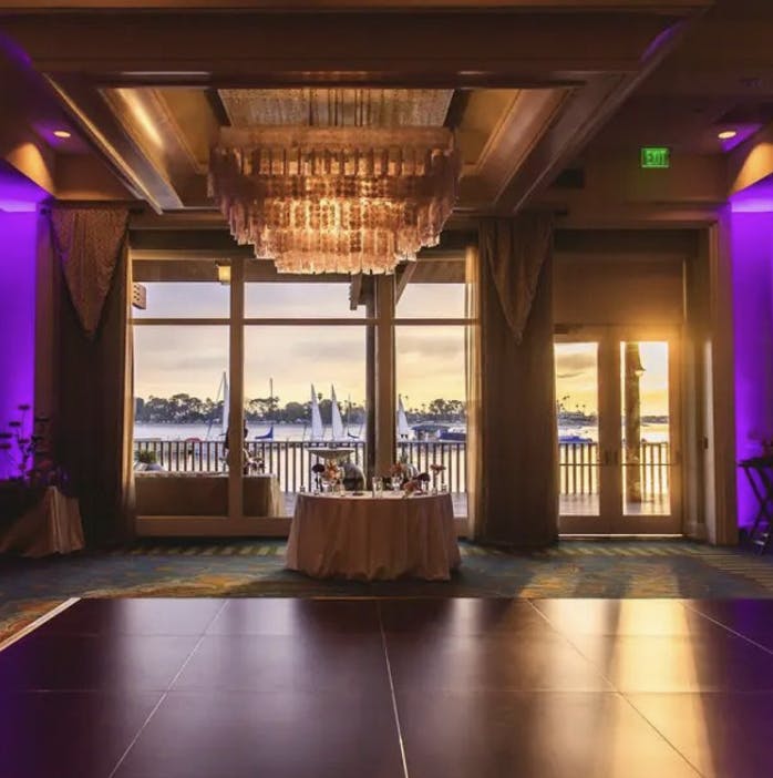 Elegant Sunset Ballroom with waterfront view, perfect for upscale events and gatherings.