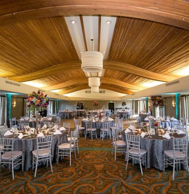 Elegant event space at Sunset Pavilion North with gray tables, perfect for weddings and corporate events.