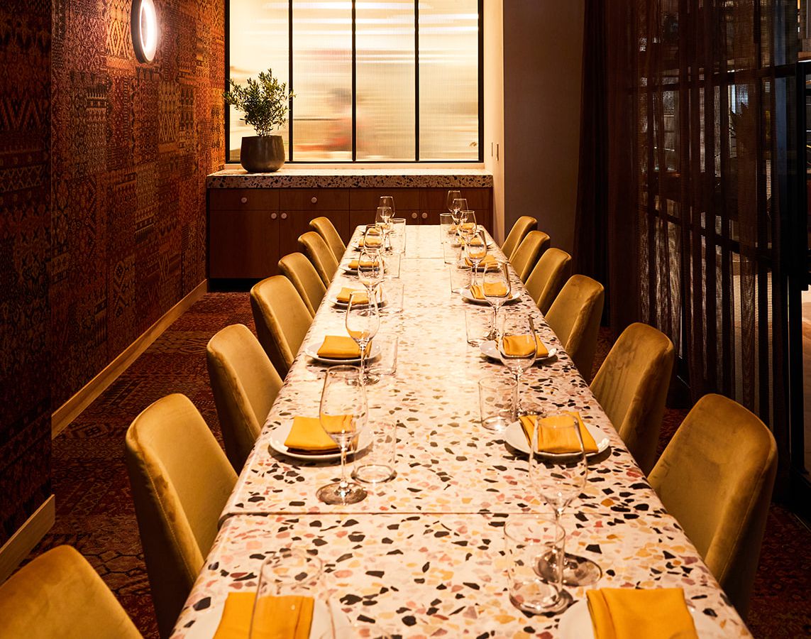 Elegant long dining table in Vistal Bar & Restaurant for private events and corporate dinners.