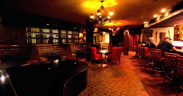 Elegant dining room with plush seating, perfect for private events and cocktail receptions.
