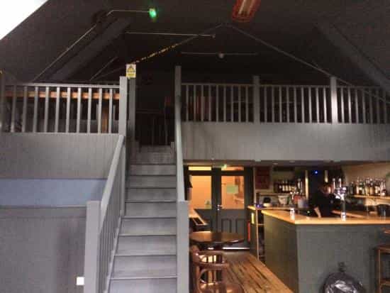Cozy Mezzanine at The Railway Inn, perfect for intimate meetings and casual events.