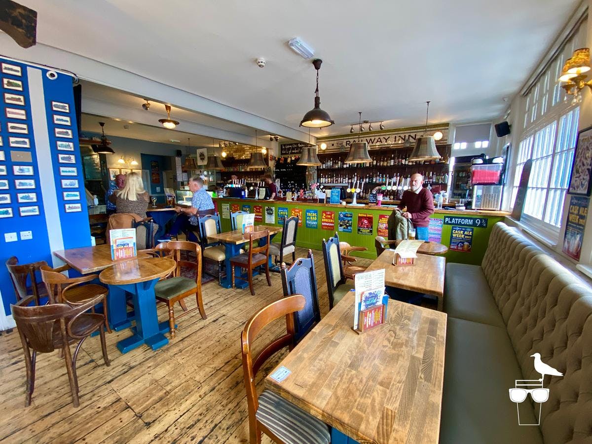 Vibrant restaurant interior with cozy booths, ideal for casual meetings and events.
