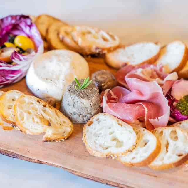 Elegant charcuterie board with meats and cheeses for networking events.
