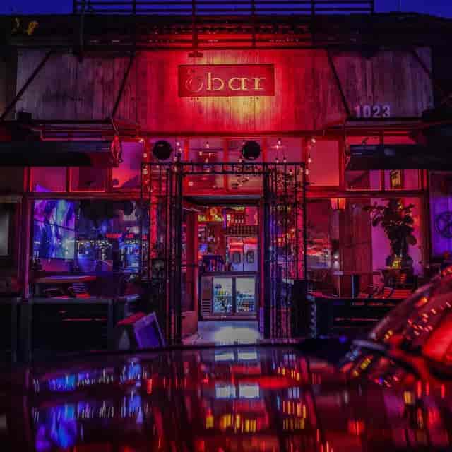Vibrant Barrel & Board venue with neon lights, perfect for events and gatherings.