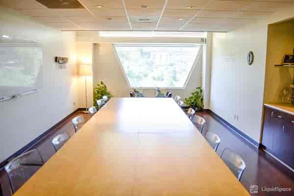 Modern Mission Valley meeting room with large table, ideal for collaborative sessions.