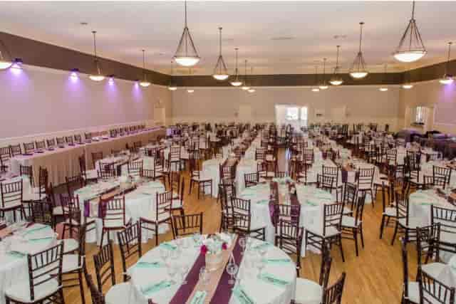 Spacious Swiss Park event hall with elegant tables, perfect for weddings and banquets.