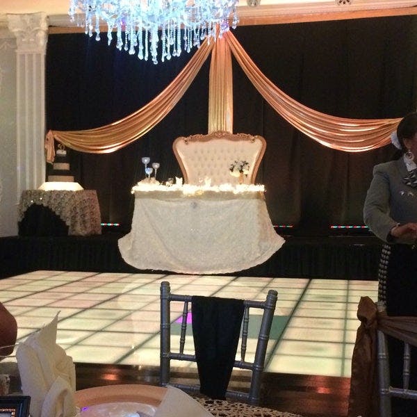 Elegant event space with draped fabric, ideal for weddings and formal gatherings.