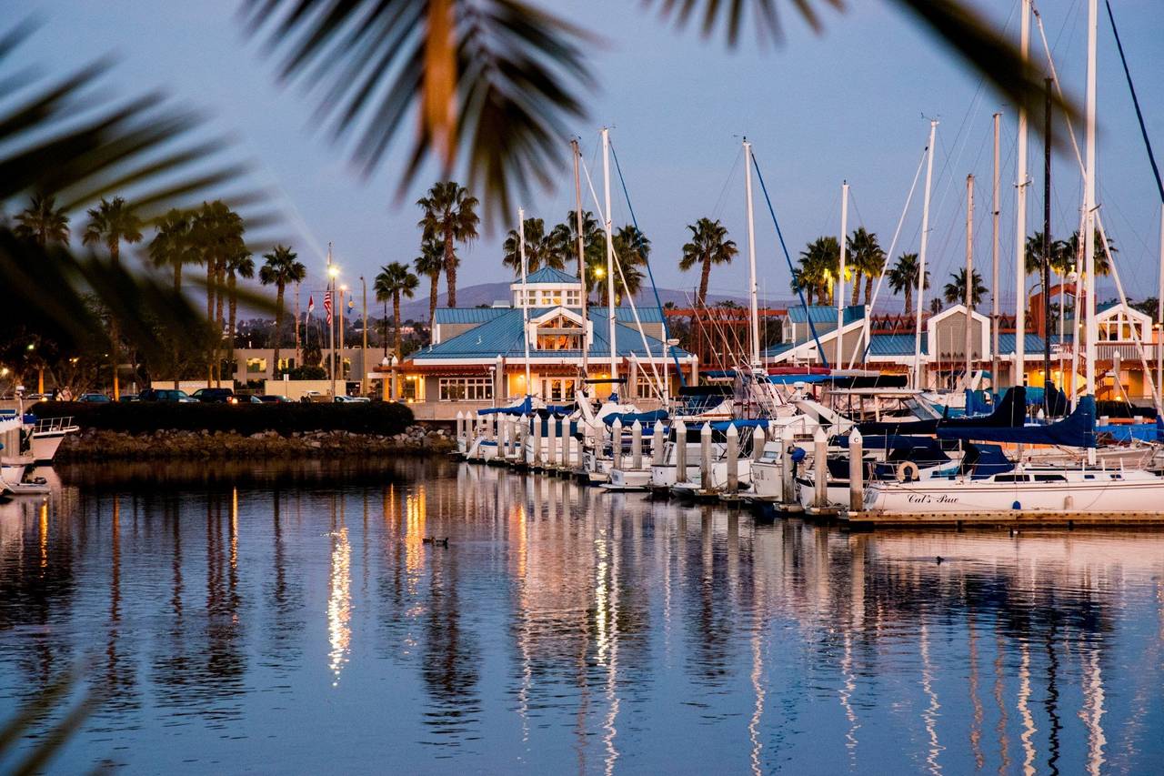 Bayside Pavilion at dusk, ideal for outdoor events with sailboats and palm trees.