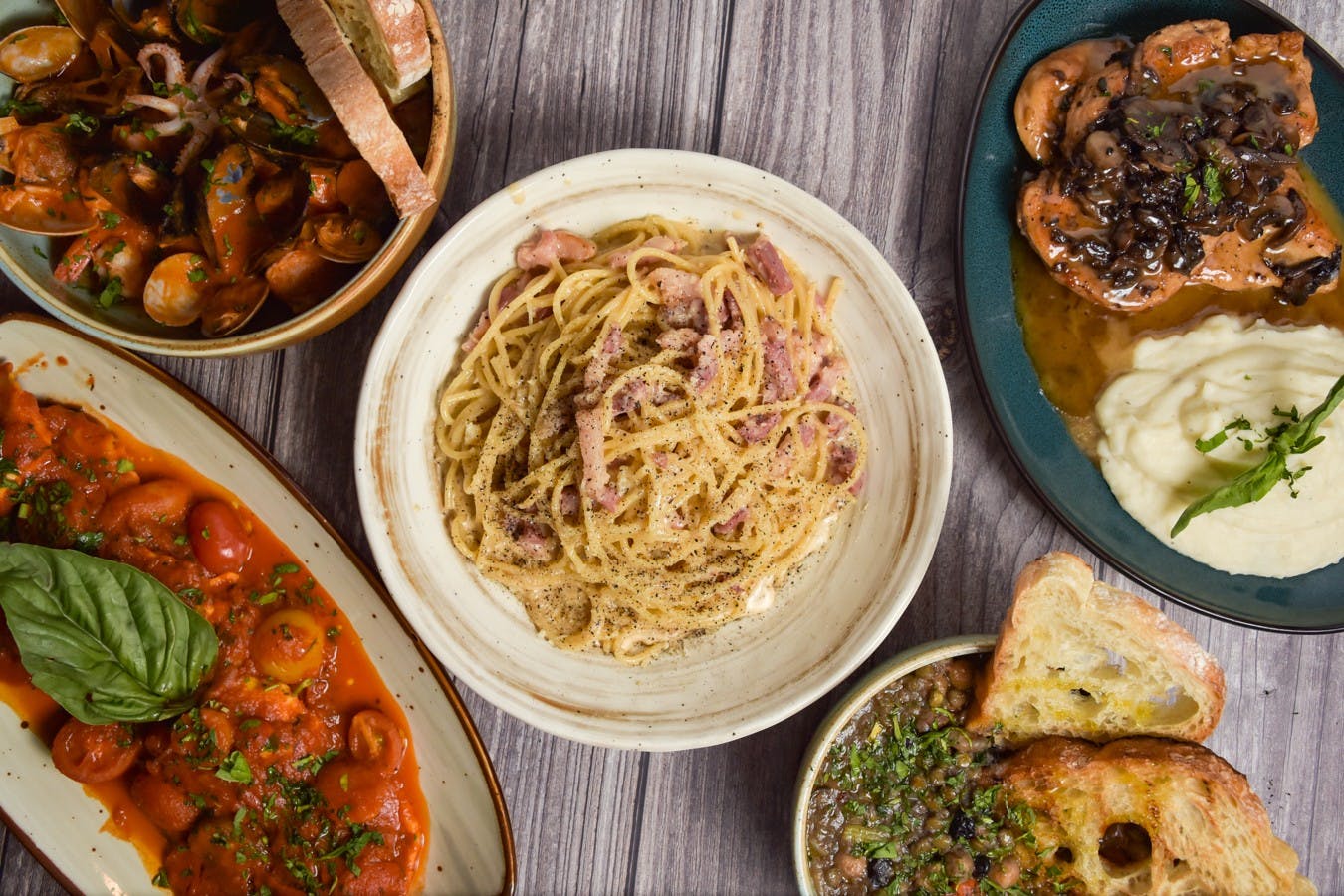 Gourmet pasta and seafood spread for high-end corporate events and gatherings.