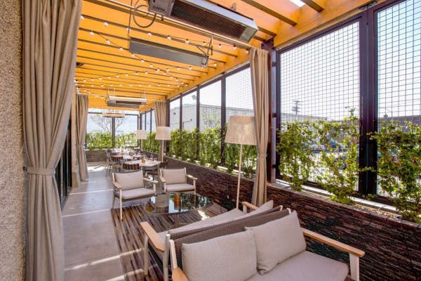Stylish covered patio at Juniper & Ivy, perfect for receptions and conferences.
