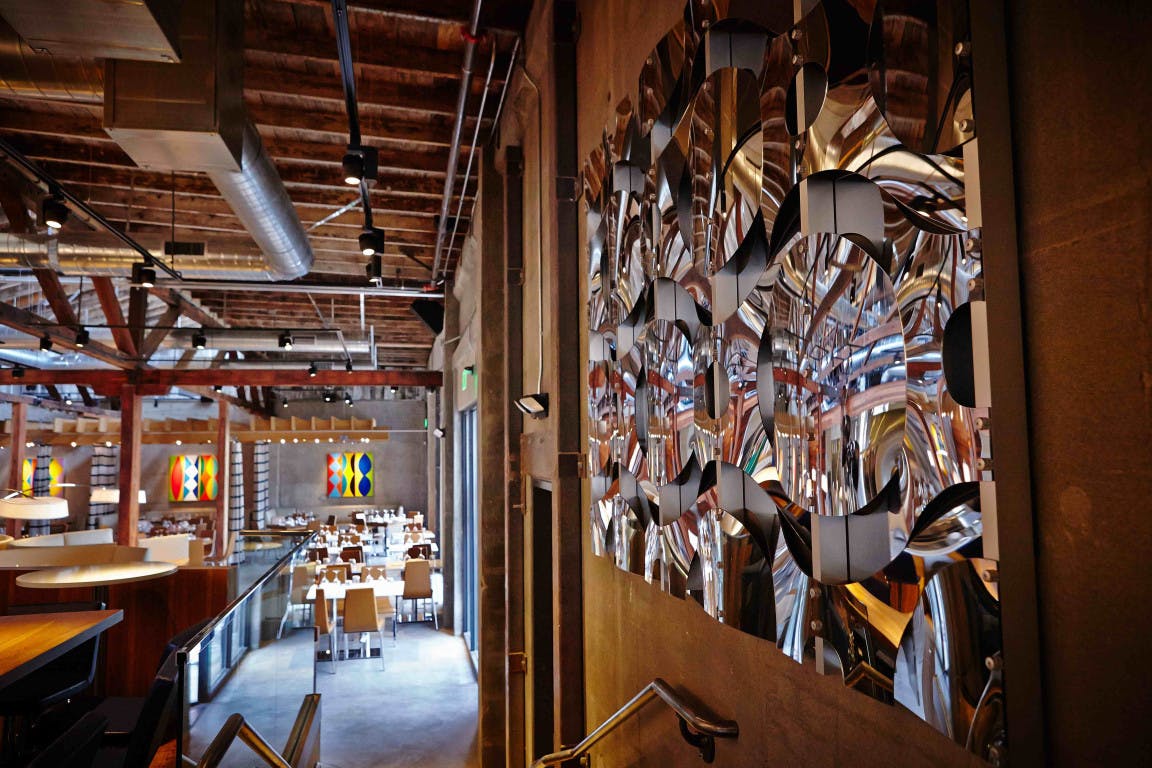 Modern event space with mirrored wall, ideal for gatherings and celebrations.